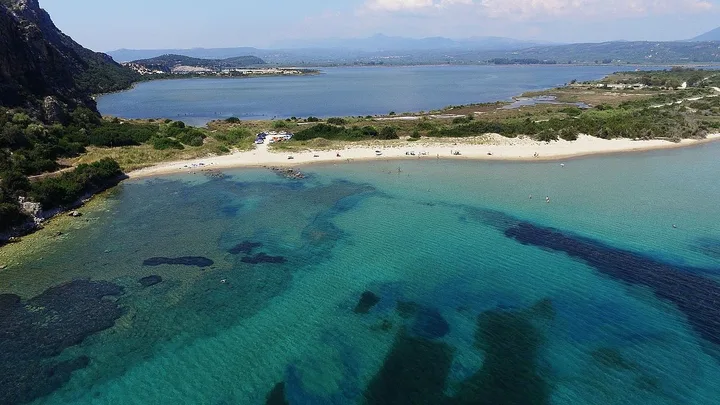 Aerial view of Divari Beach and the Yialova coastal lagoon near the Almyrolaka Beach area.