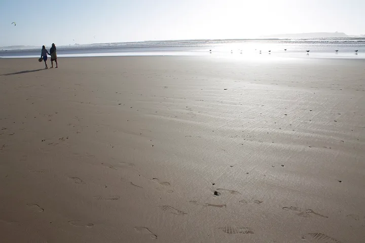Wide sandy beach and Atlantic shoreline at Essaouira, Morocco.