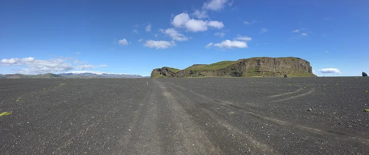 Hjörleifshöfði rising from the black-sand landscape in South Iceland.