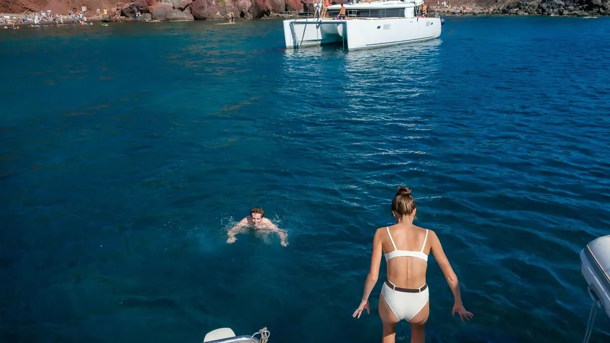 Santorini: Semi-Private Catamaran Cruise + Food+ Transportation Provided by SYRIGOS M.C.P.Y.